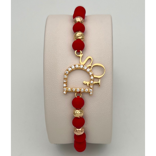 PULSERA TEJIDA CON DIJE `DIOS´ Y BALINES EN DOS OROS DE 18K