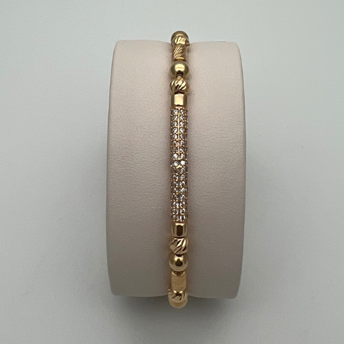 PULSERA TEJIDA CON DIJE BARRIL, BARRILES DIAMANTADOS Y BALINES EN ORO DE 18K