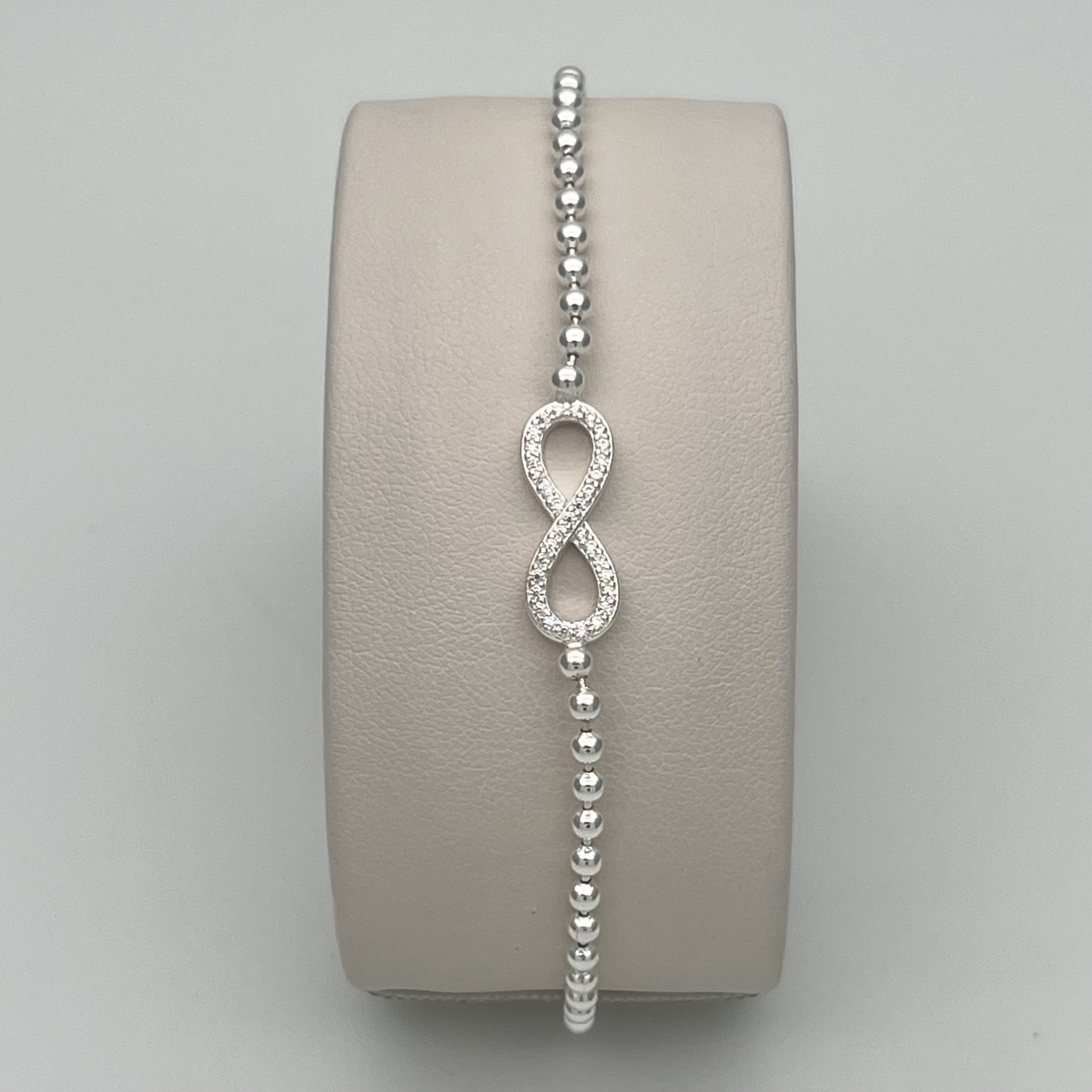 PULSERA INFINITO CIRCONES BLANCOS Y BALINES EN PLATA